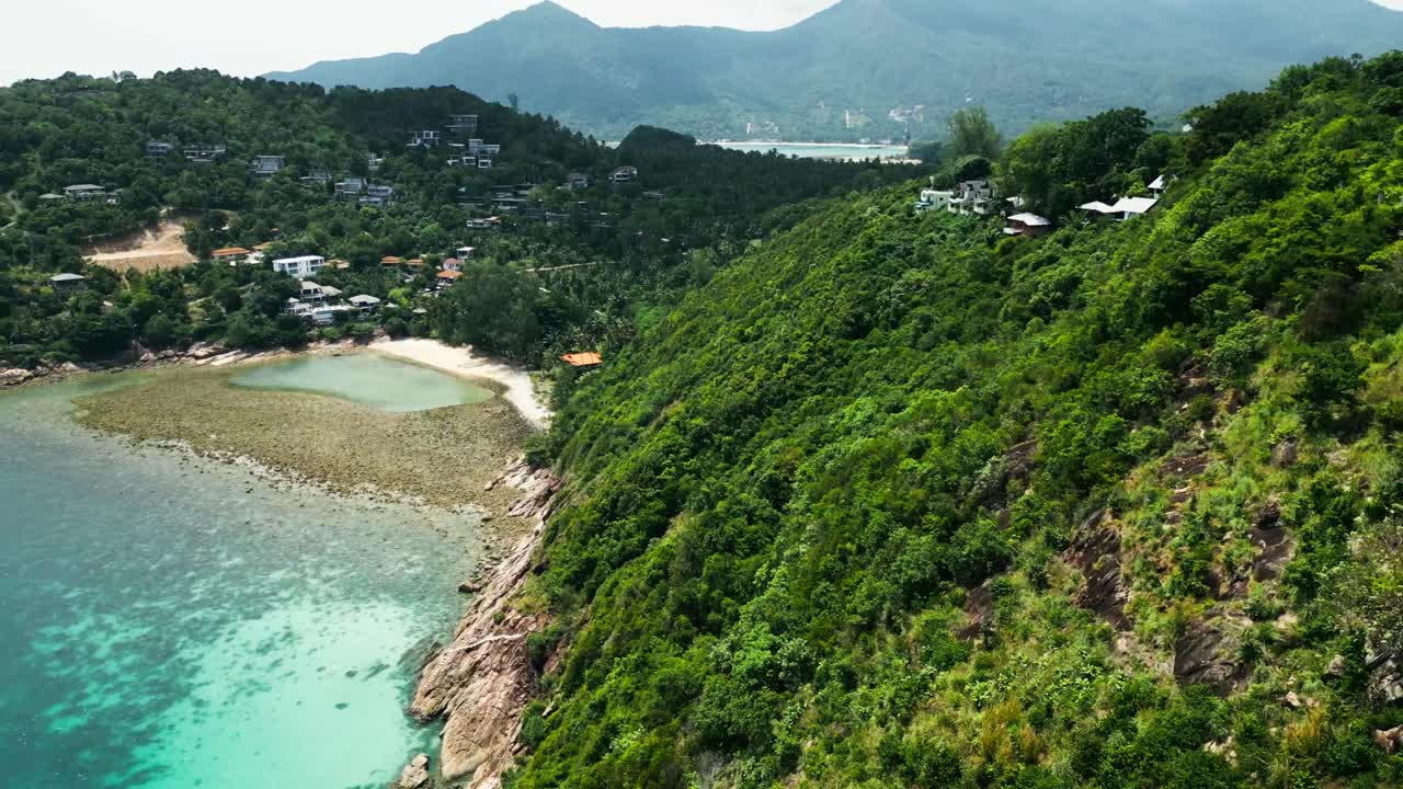 Aerial Fly Above Koh Phangan Islet Secluded beach landscape in Jungle mountain village surroundings, Southeast Asian travel destination establishing shot
