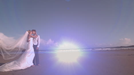 animation of light moving over happy caucasian newly married couple on beach