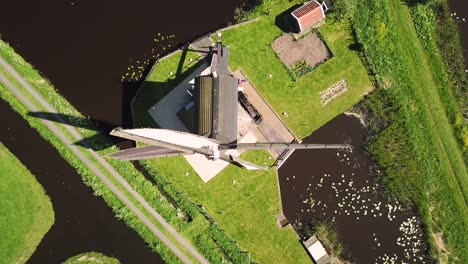 traditional windmill in dutch landscape aerial shot top down birds eye view