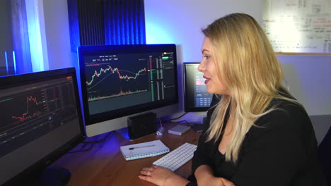 happy female stock broker trader looking a charts