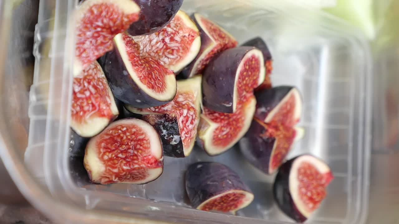 Close-up of sliced figs in a container