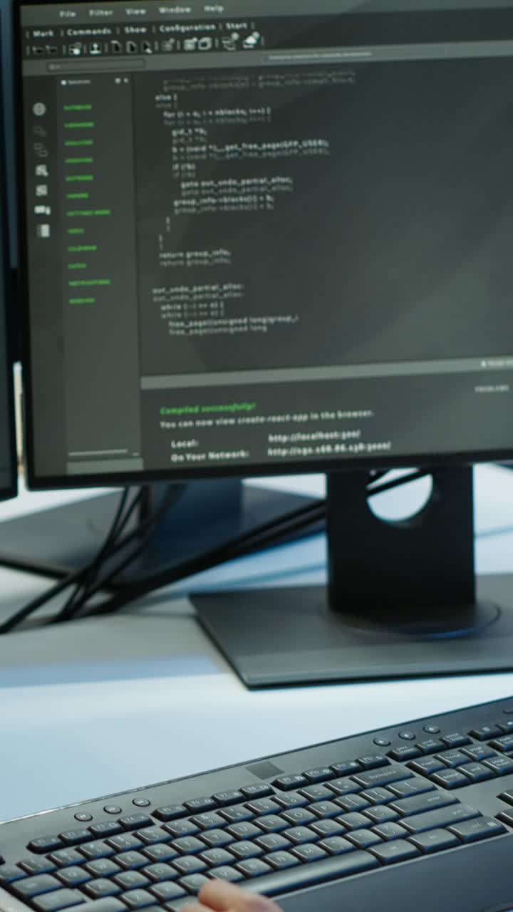 Close Up of Hands Typing Programming Code on Computer Keyboard
