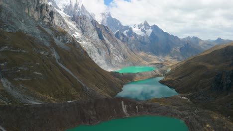 stunning aerial view of turquoise glacial lakes nestled among dramatic peaks near the huayhuash trekking circuit in the peruvian andes