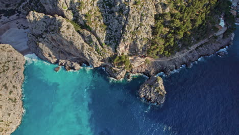 rocky cliff around the sa calobra beach on a sunny day in mallorca, spain