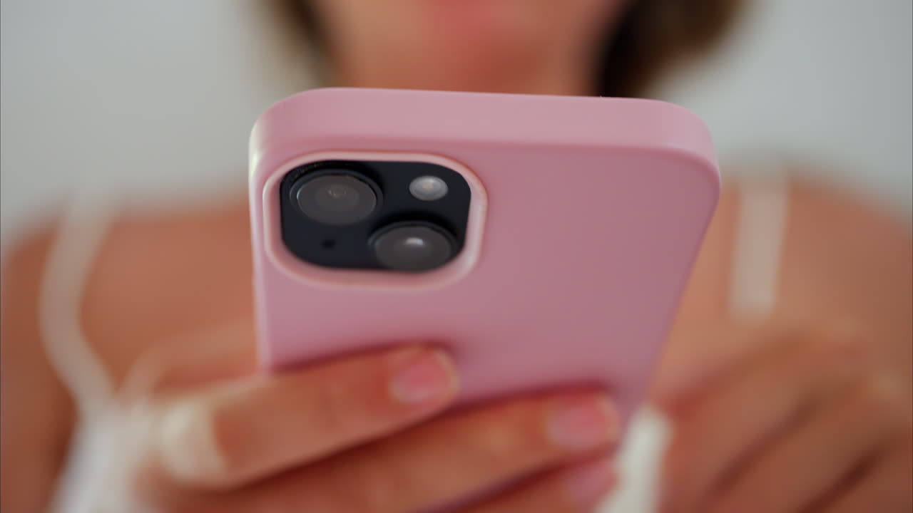 Close up of a woman scrolling on her phone