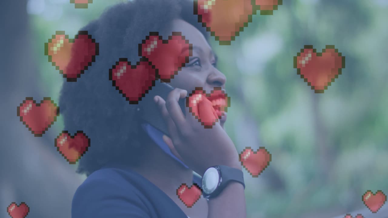 Animation of heart icons over african american woman talking on smartphone