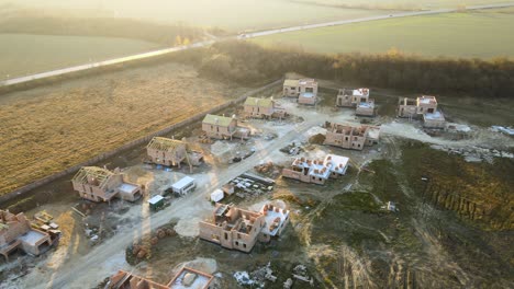 industrial building site in rural area with residential houses under construction for future sale or leasing. concept of real estate development