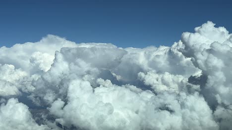 flying across a stormy summer sky in the afternoon, as seen by the pilots