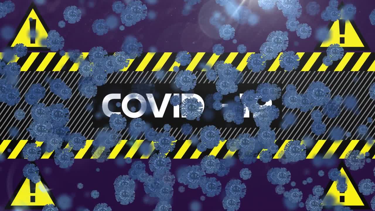 코로나19 텍스트 배너와 경고 표지판 위에 떠있는 여러 코로나19 세포의 디지털 애니메이션