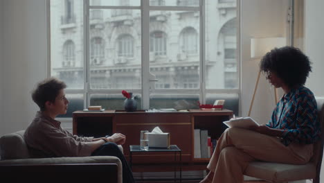 Young Woman Having Consultation with Psychologist