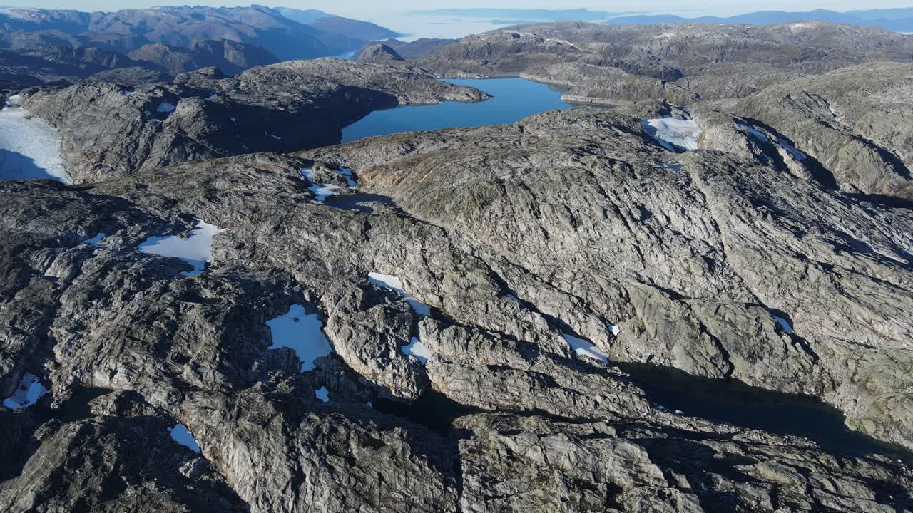 Mountain lake and glacier in Folgefonna National park. Drone footage
