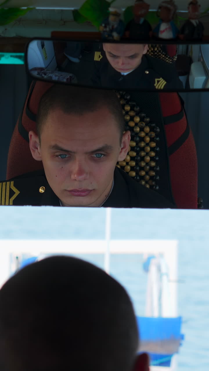 Man in uniform reflected in mirror