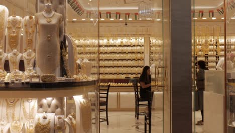 jewellery gold store customers exiting at deira dubai, panning shot
