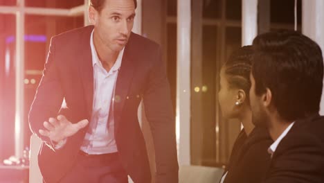 Businessman-leading-meeting-in-conference-room