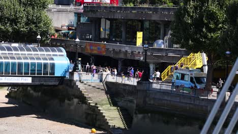 people enjoying a sunny day by the river