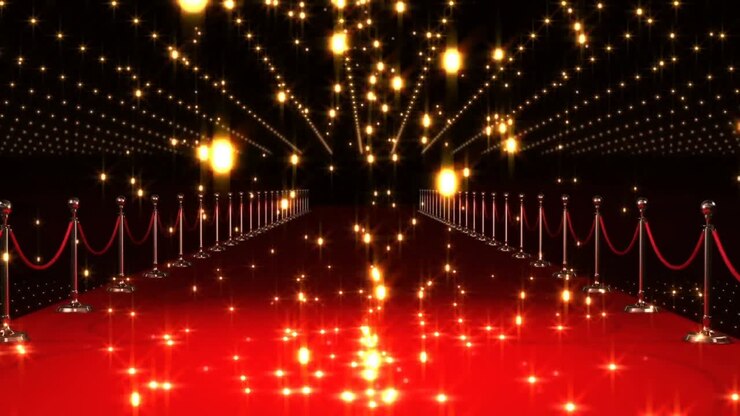 Animazione di forme rosse e sfere di fiamma incandescenti che cadono su una location con tappeto rosso.