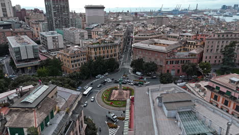 traffic flow around piazza corvetto in genoa, aerial view over rooftops