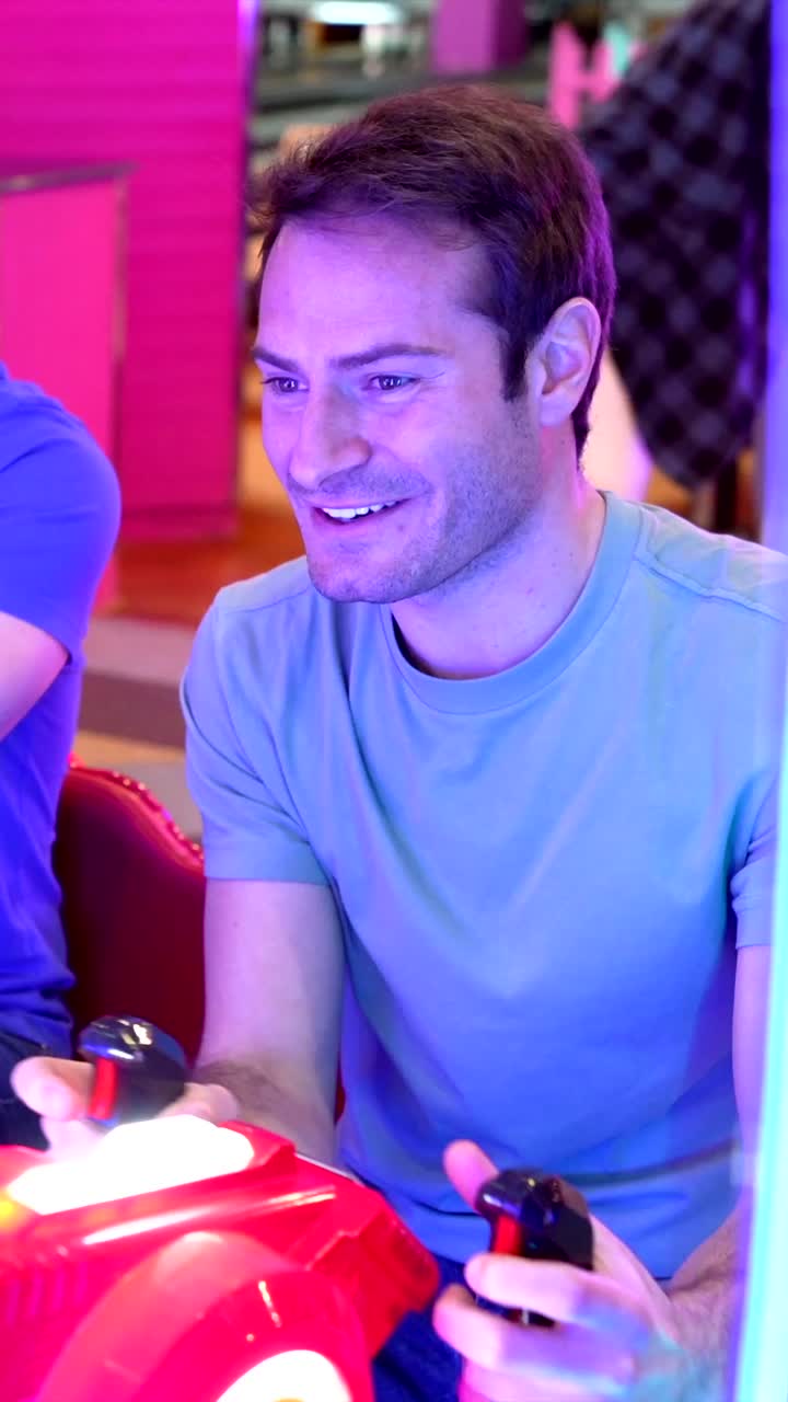 Men Having Fun at the Arcade