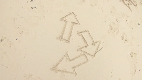 arrows drawn in the sand