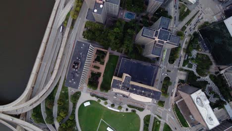 aerial view over buildings in downtown pittsburgh, usa - rotating, top down, drone shot