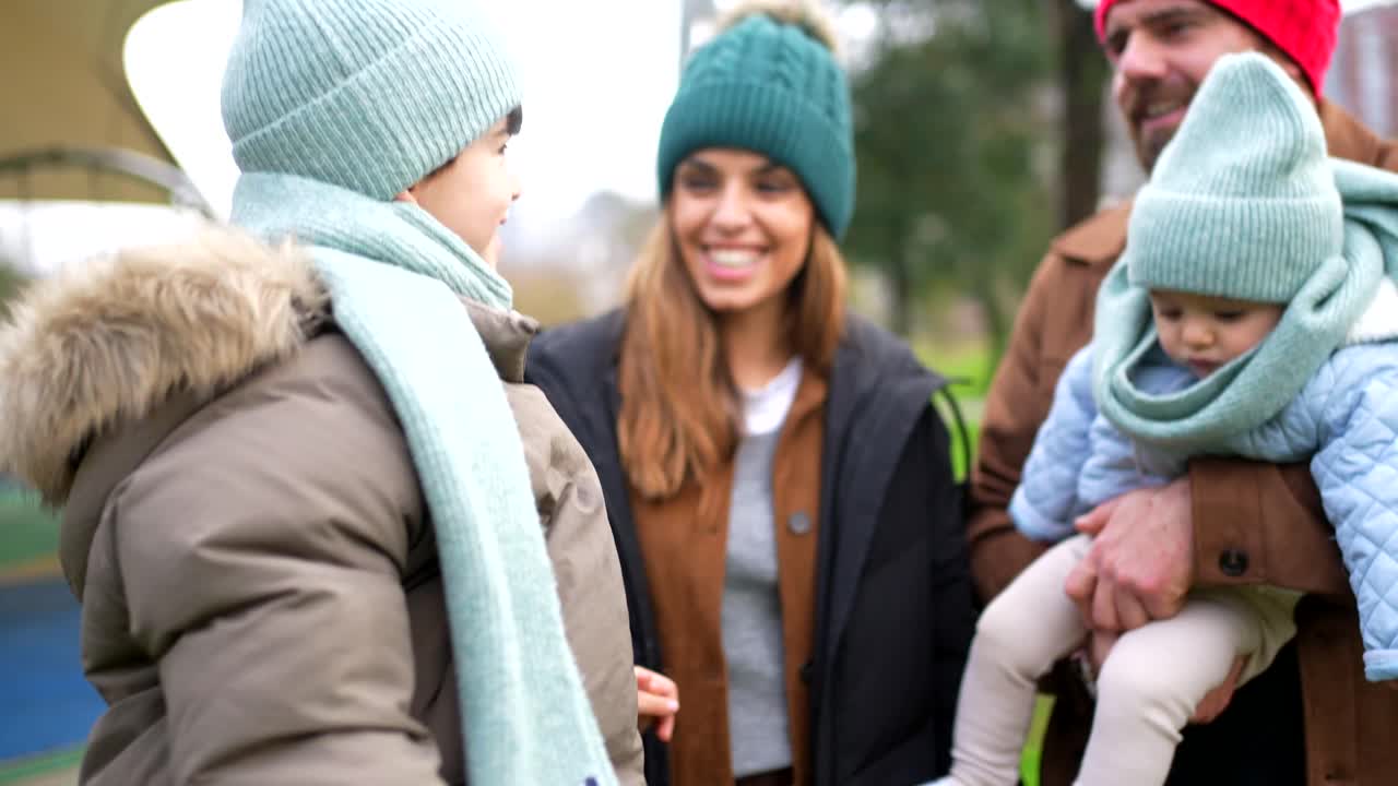 Family enjoying a day out in winter clothing