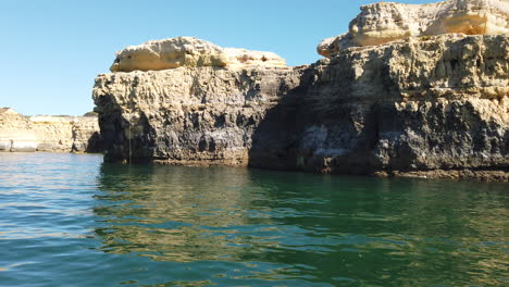 view of a rocky coastline from a boat shot with a stabilizer camera