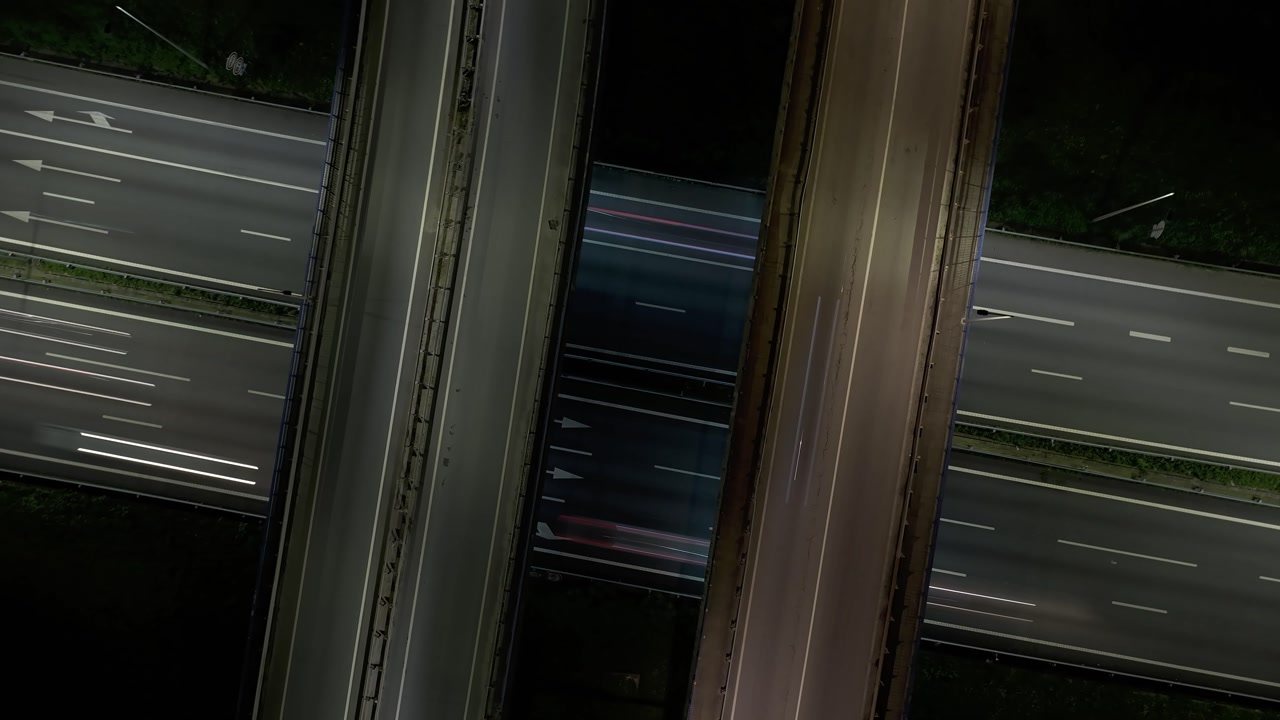 Hyperlapse of highway crossing with rush hour traffic at night. Long exposure shots.