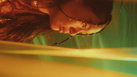 beautiful asian woman watching music concert in nightclub