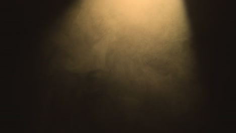 abstract textured warm smoke in slow motion in spotlight. floating fog in light spot background. mysterious haze