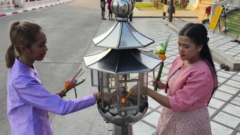 women praying at a temple