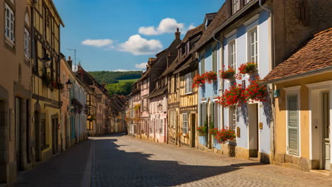 a charming cobblestone street lined with colorful historic buildings leading to green hills