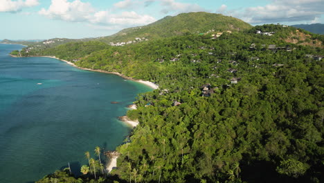 Beach-of-Koh-Samui-Island-in-Thailand-at-sunset-surrounded-by-palm-trees,-aerial-orbital