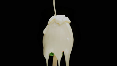 thick creamy dairy topping drips on healthy strawberry fruit dessert, macro