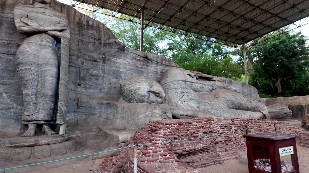Impressive reclining Buddha statue at Gal Vihara, Polonnaruwa. Ancient rock temple showcasing remarkable Buddhist artistry and historical significance in Sri Lanka.