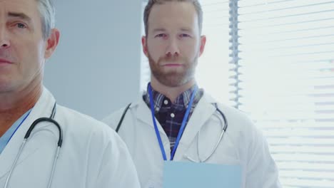 Front-view-of-Multi-ethnic-doctors-standing-in-a-row-at-hospital