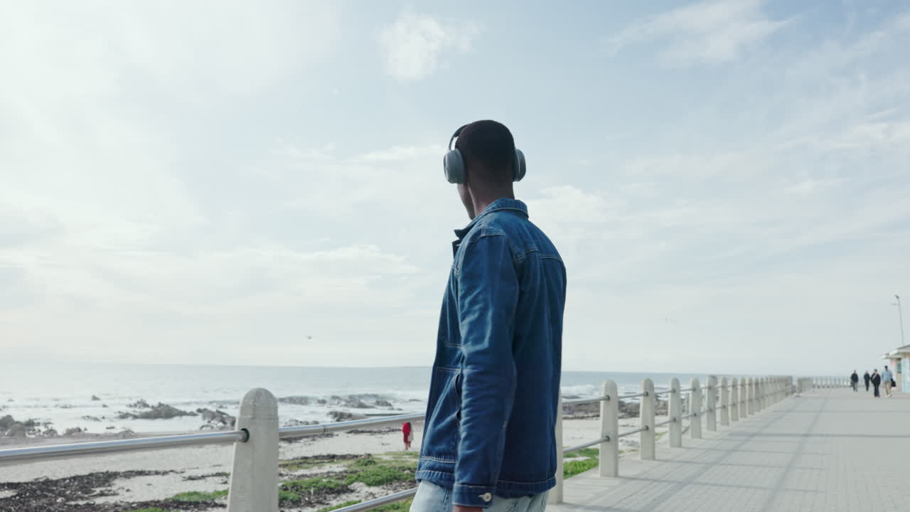 Man enjoying ocean view with headphones