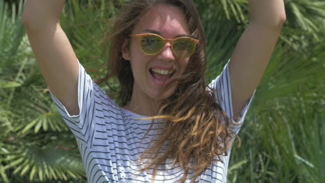 woman going crazy raising her hands