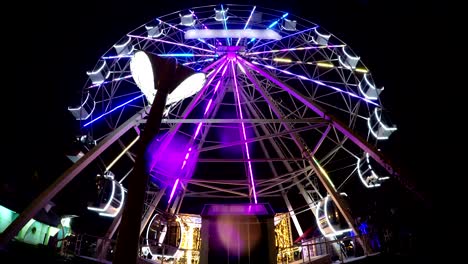 empty ferris wheel magical attraction spinning at night illuminated led timelapse