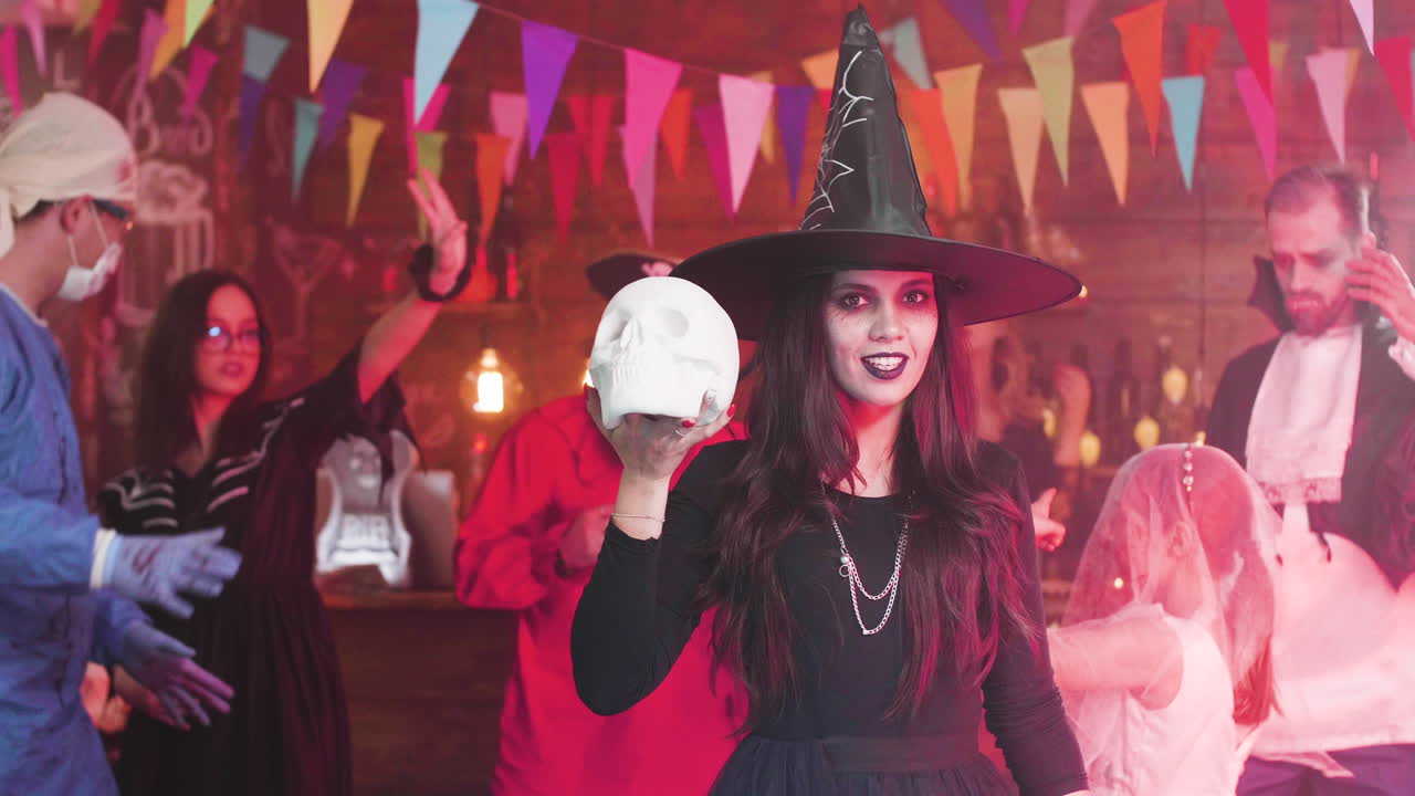 Halloween Party with Witch and Costumed Guests