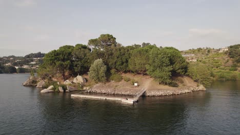 Wooden-pier-at-Ilha-dos-Amores-or-love-Island-in-middle-of-river,-Castelo-de-Paiva-in-Portugal