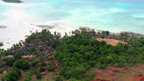 fly over of a tropical island village off madagascar