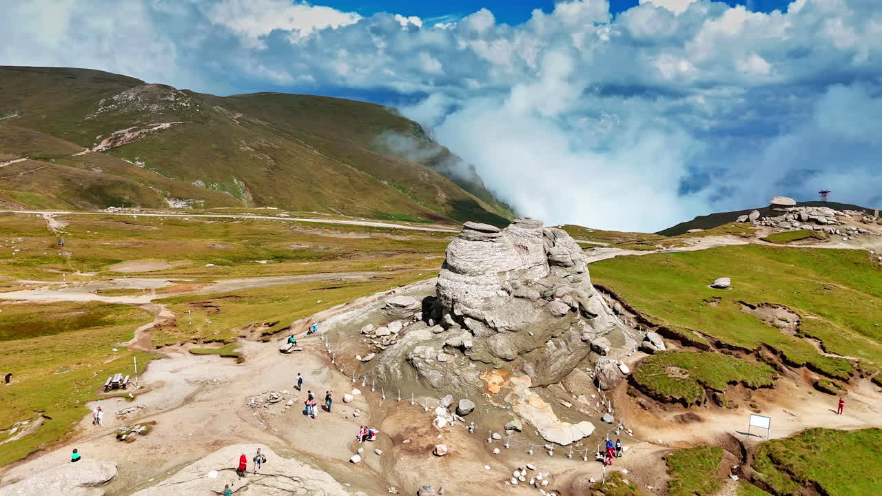 Sphinx-like rock formation on Caraiman Plateau. Distinctive rock shaped like a sphinx stands prominently on the plateau of Caraiman Mountain