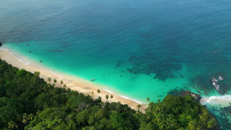 drone flying around the boi beach on the coast of sao tome, sunny day in africa