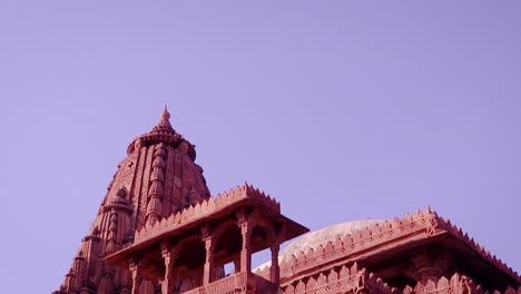 red stone ancient hindu temple architecture from unique angle at day