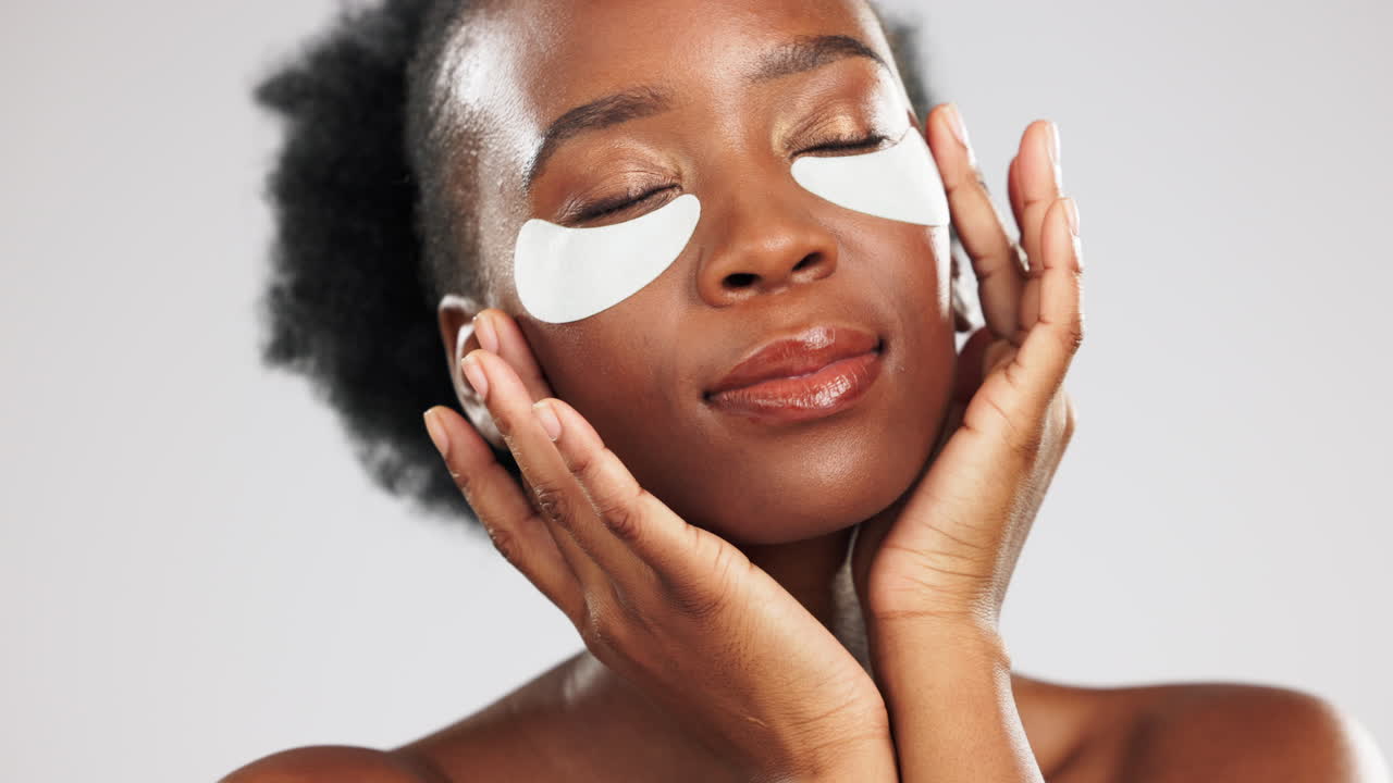 Face, skincare and black woman with eye patches