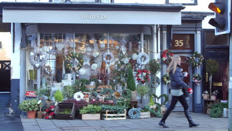 exterior of florists shop with traffic and pedestrians