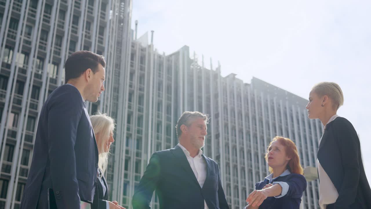 Business Professionals Meeting Outdoors in an Urban Setting