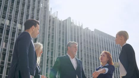 business professionals meeting outdoors in an urban setting