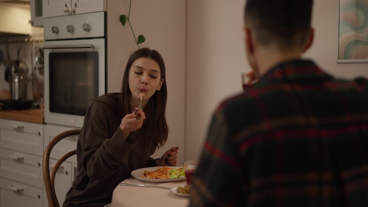 Couple eating dinner in the kitchen