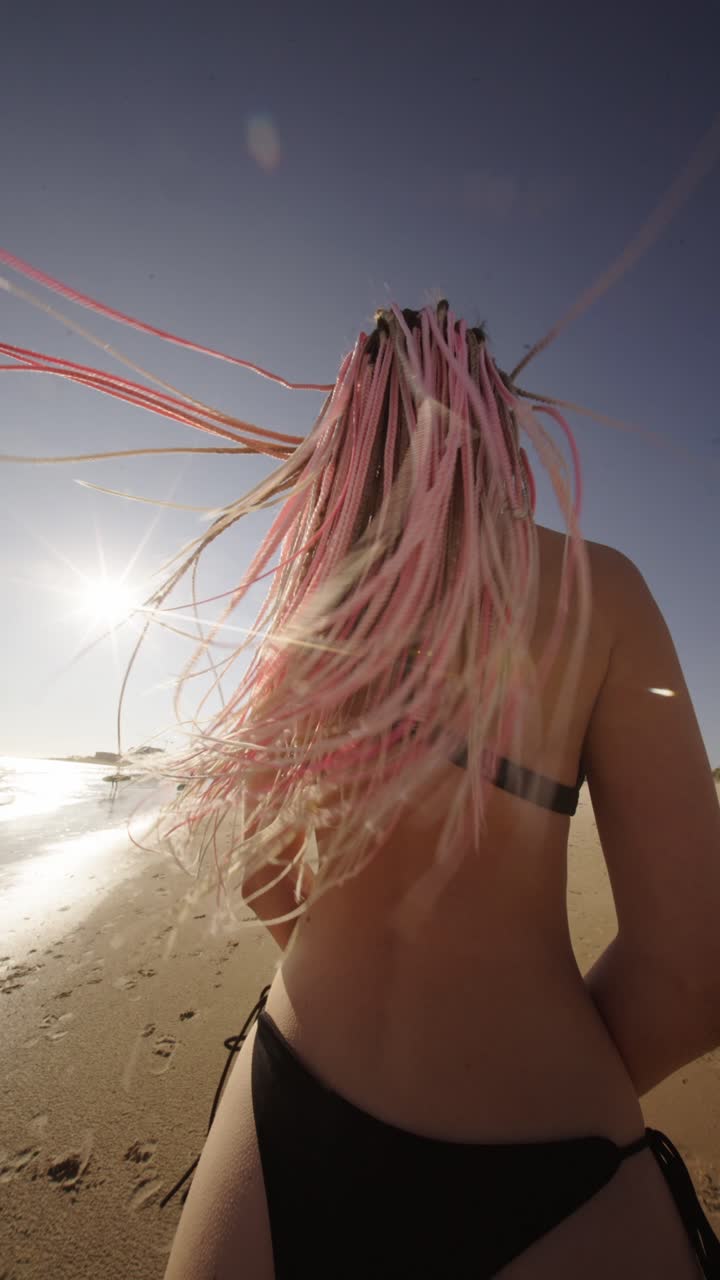 Woman with braids on the beach